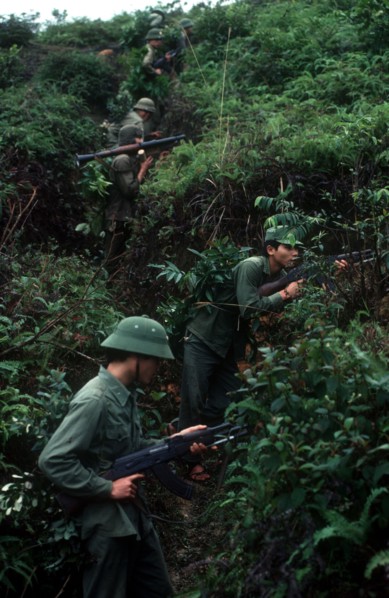 VIETNAM, Cao Bang Province, Pac Bo, Soldiers on a training exercise.  View up hillside along