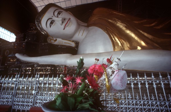 MYANMAR, Pegu, Shwethalyaung reclining Buddha.  Part view of head and arm.