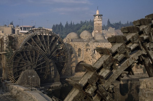 SYRIA, Central, Hama, Wooden norias or waterwheels on the Orontes river and the Al-Nuri Mosque