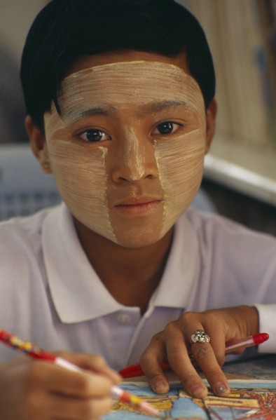MYANMAR, Children, Single Girls, Young girl wearing thanaka paste on her face in traditional