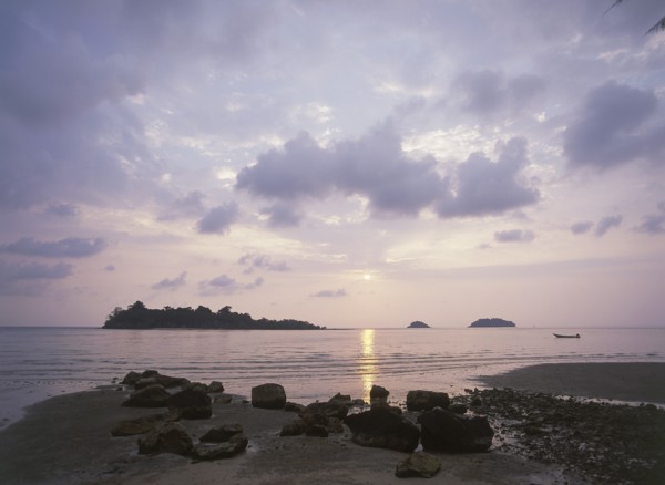 THAILAND, Trat Province, Koh Chang, "Kai Bae Beach view of sunset over Koh Man Nai, Koh Man Nok and
