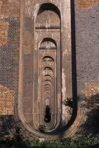 ENGLAND, West Sussex, Haywards Heath, Balcombe. View through line of arches under railway viaduct.