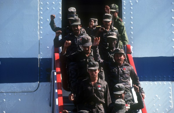 CUBA, Military, Waving soldiers returning from Angola walking down the gangway from a ship