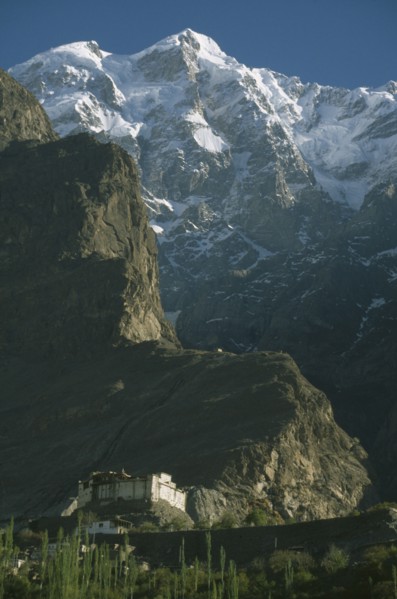 PAKISTAN, Northern Areas, Hunza Valley, "Baltit  Fort built on a cliff side with snow covered peaks