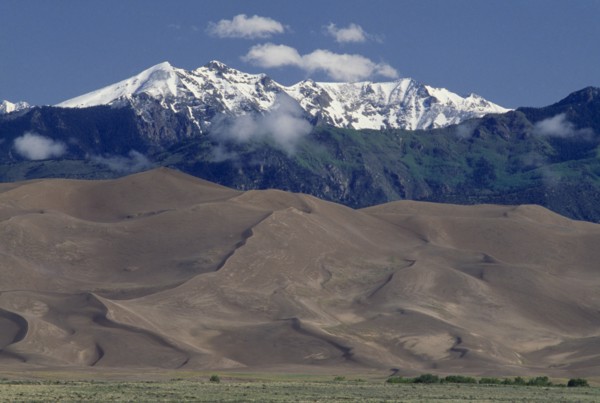 USA, Colorado, Saguache, Great Sand Dunes National Monument. Snow capped mountain landscape behind