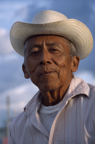 MEXICO, Yucatan, Hoctun, "Smiling, elderly men in hat, head and shoulders portrait."