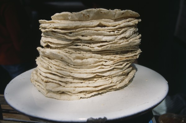 MEXICO, Mexico City, Stack of tortillas on white plate.
