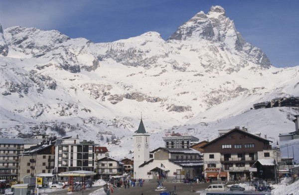 ITALY, Valle d’Aosta, Breuil Cervinia, "Ski resort town with church, hotel and petrol pumps with