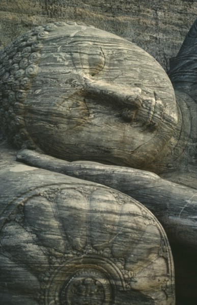 SRI LANKA, Polonnaruwa, Stone carved reclining Buddha detail of head lying on hand