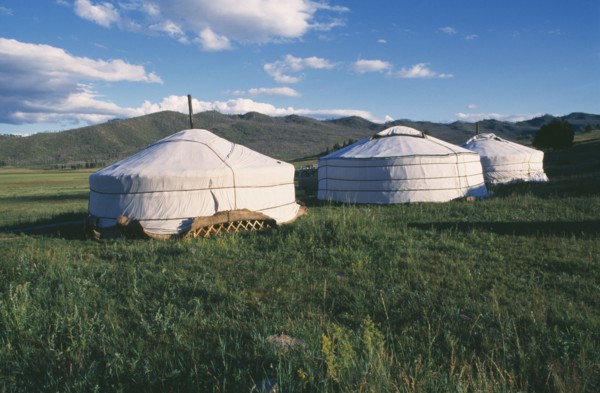 MONGOLIA, Khentii Province, General, Gers in mountain landscape.