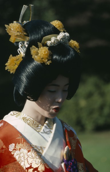 JAPAN, Honshu, Tokyo, Shinto wedding with bride in traditional dress and elaborate hairstyle