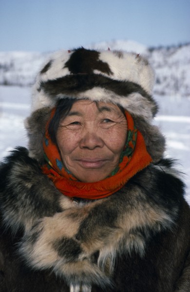 RUSSIA, Kamchatka, Koryak woman.  Head and shoulders portrait outside dressed in furs.
