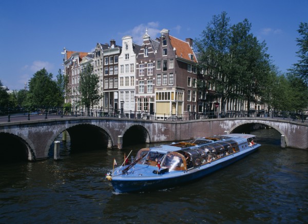 HOLLAND, Noord, Amsterdam, Tourist boat travelling down  the Keizersgracht canal