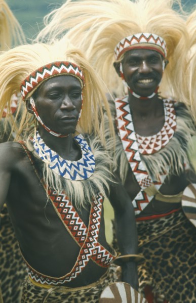 RWANDA, Tribal Peoples, Tutsi dancers wearing lion mane head dresses.