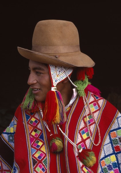 PERU, Cusco, Vilcanota, Portrait of boy from Tinqui wearing typical hat and poncho.