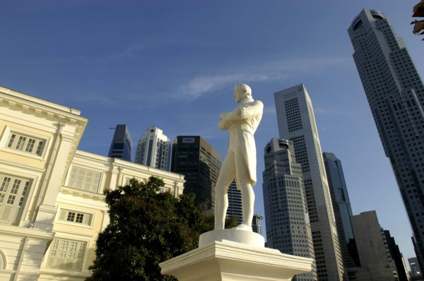 SINGAPORE, Raffles City, Statue with skyscrapers of the city skyline behind