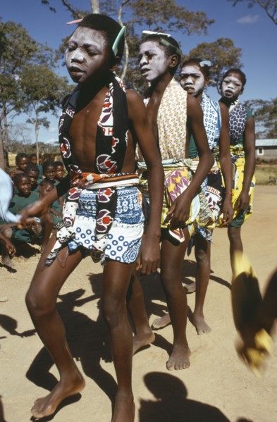 TANZANIA, Festivals, Makonde girls wearing ritual face whitening and dancing during female