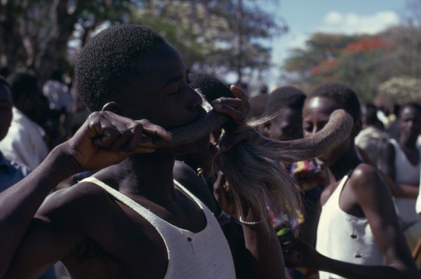 TANZANIA, Dodoma, Ngomas dancers using an animal horn as a musical instrument