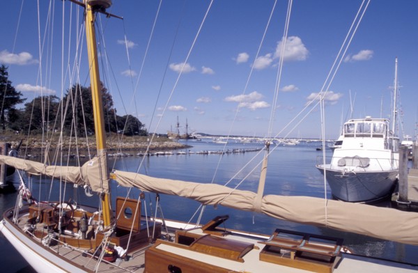 USA, Massachusetts, Plymouth, View over moored boats in the harbour with the Mayflower 2 in the