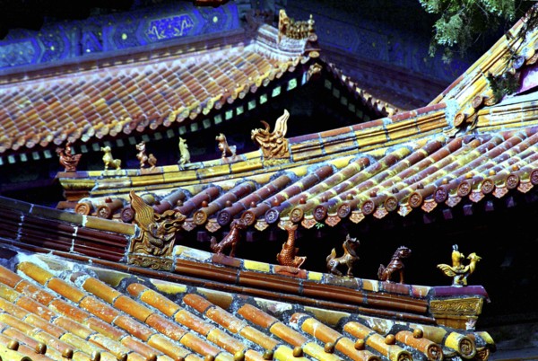 CHINA, Shandong, Qufu, View along line of traditional style rooves with decorative features in the