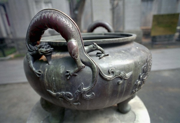 CHINA, Beijing, Forbidden City, Ancient Emperors cooking pot with handles in the form of dragons