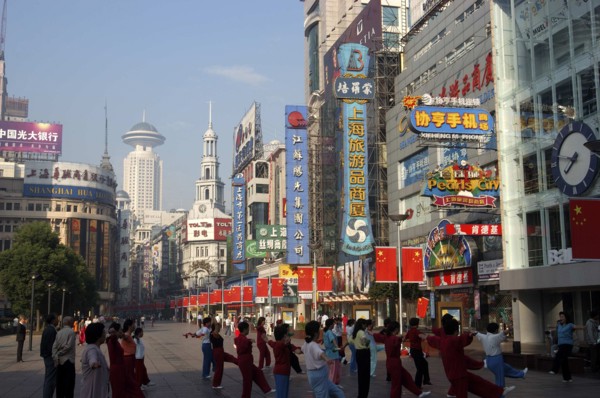 CHINA, Shanghai, Nanjing Road walking street. Commercial shopping street with group of people