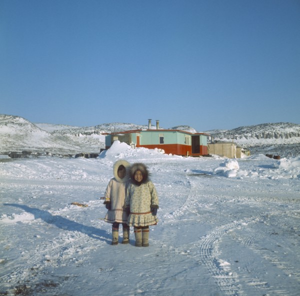 CANADA, Nunavut, Baffin Island, Young Innuit girls outside settlement.