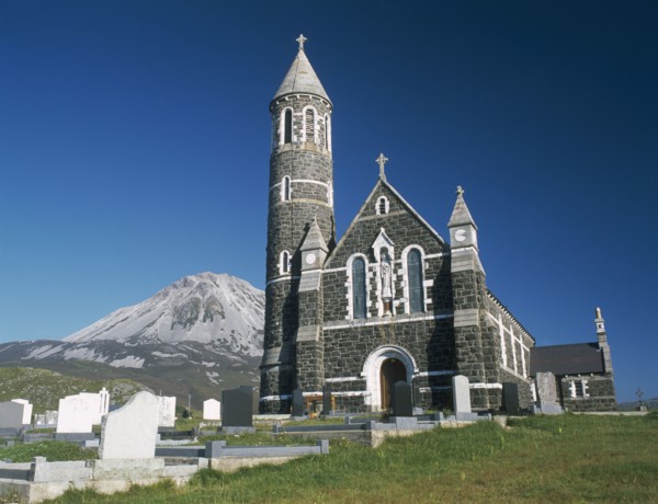 IRELAND, County Donegal, Dunlewy Village, Roman Catholic church and graveyard with Errigal peak of