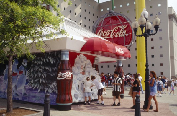 USA, Georgia, Atlanta, World of Coca Cola pavilion exterior with crowds of visitors.