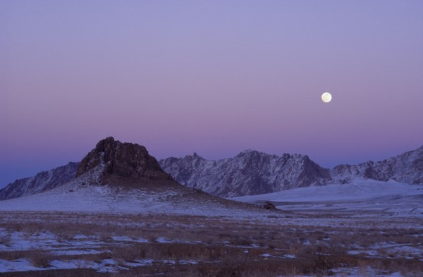 MONGOLIA, "				", Hovd Province, Mountains lightly covered in snow at sunset with pink sky. Rtnd 2