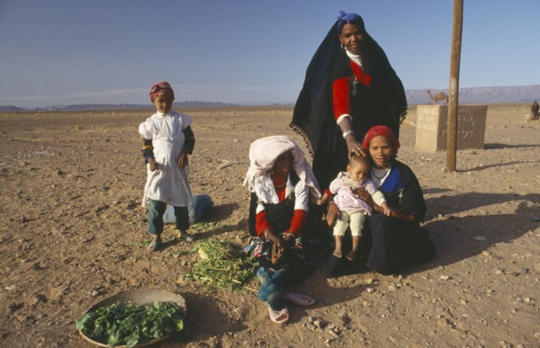 MOROCCO, Family, Tribal woman and children in desert area.