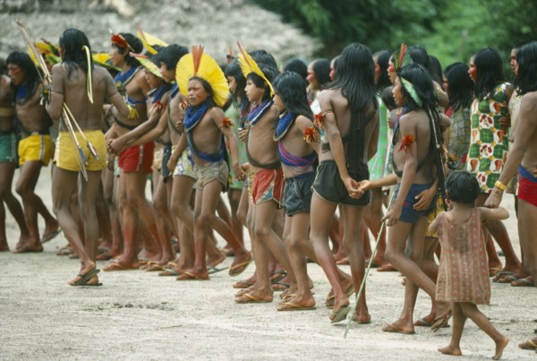 BRAZIL, Amazonas, People, Group of Xikrin Indians wearing feather head dresses and bead jewellery