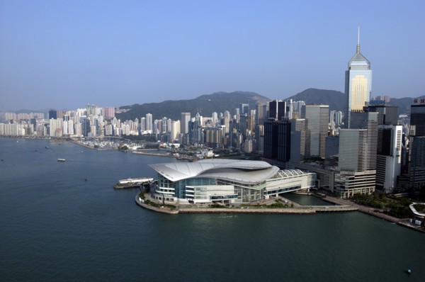 HONG KONG, Kowloon, Aerial view over the New Convention Centre on the waterfront and cityscape