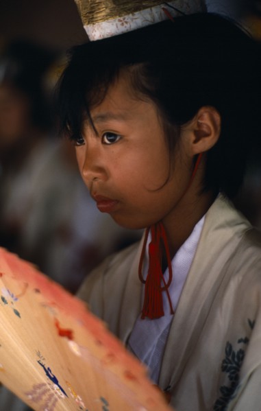JAPAN, Kyushu, Kaseda, Portrait of young girl dressed as shrine maiden during Samurai Festival.