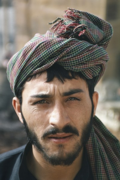 PAKISTAN, People, Portrait of a man wearing a head scarf.