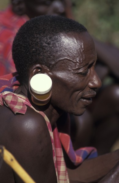 KENYA, , A maasai man at an intiation ceremony for the Moran coming into manhood with ears