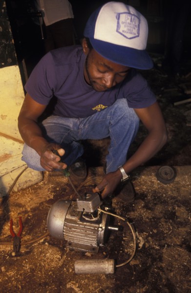KENYA, Loitokitok, A mechanic repairs an electric motor