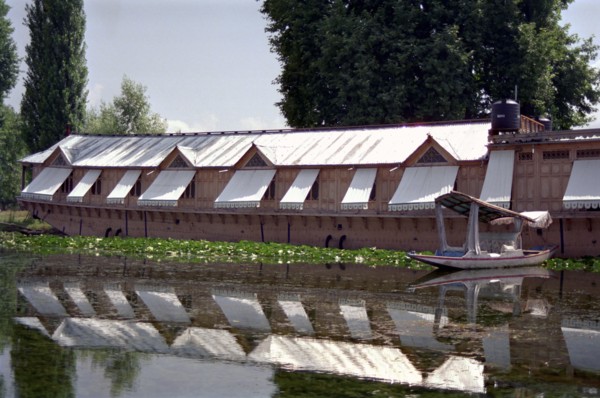 INDIA, Kashmir, Srinagar, Nagin Lake. Large modern houseboat with window shades