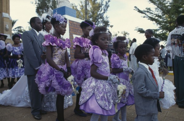 UGANDA, Rubanga, Christian wedding ceremony.  Bride and groom with bridesmaids and page boys