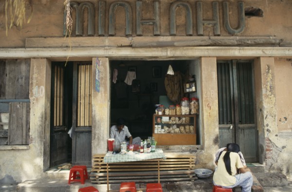 VIETNAM, North, Hanoi, Street cafe with customers.