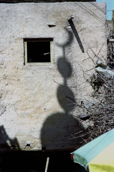 CHINA, Xinjiang, Kashgar, Shadow cast on a building wall of an Islamic crescent moon symbol usually
