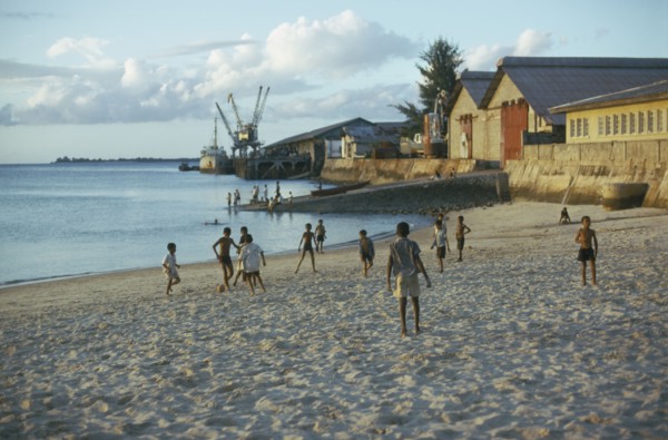 TANZANIA, Zanzibar Island, Boys playing football on the beach.
