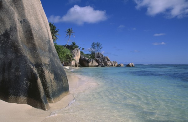 SEYCHELLES, La Digue Island, Anse Source D’Argent. View from behind large rock boulders on golden