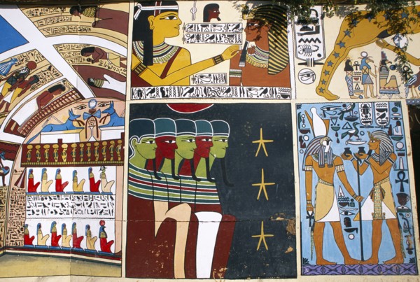 EGYPT, Dra Abul Naga, Detail of painted mural on exterior wall of alabaster shop.