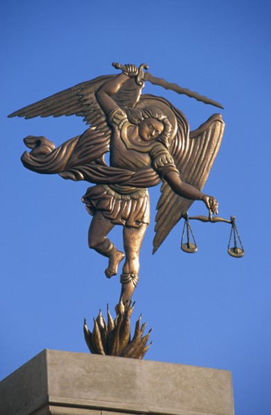 EGYPT, Nile Valley, Aswan, Coptic Cathedral.  Statue of the Archangel Michael holding sword and