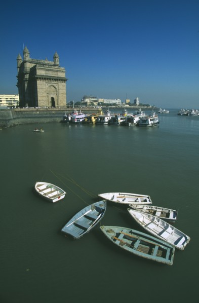 INDIA, Maharashtra, Bombay, Colaba area.  View over harbour toward the Gateway of India with
