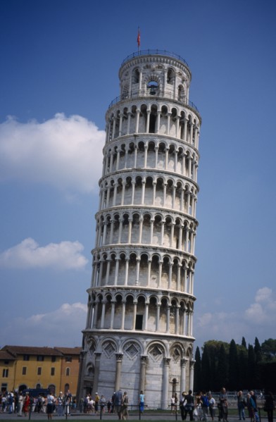 ITALY, Tuscany, Pisa, The Leaning Tower with tourists gathered at the base