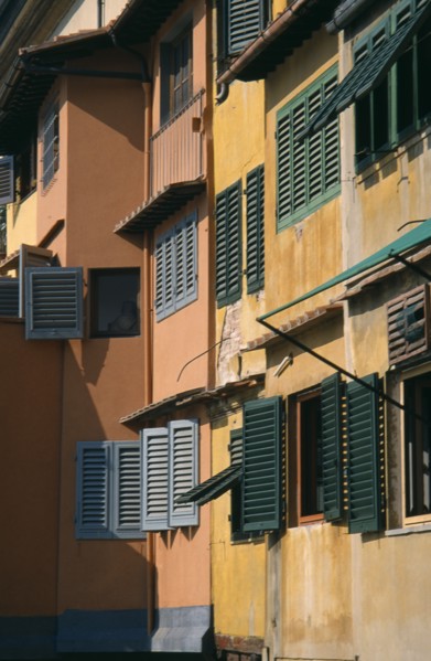ITALY, Tuscany, Florence, Ponte Vecchio. Facades of colourful buildings with detail of wooden