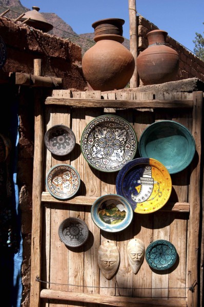 MOROCCO, Marrakech, Display of ceramic plates and vases on a wooden cabin door