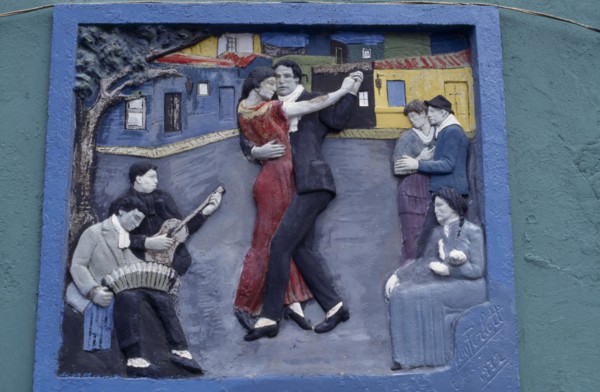 ARGENTINA, Buenos Aires, La Boca.  Painted tableau of tango dancers in the old port district.